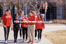 New Student Orientation Leader Jacob Vanderford leads a group across campus. NSE Leaders walking on 