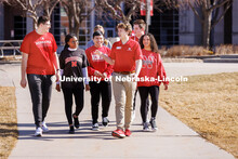 New Student Orientation Leader Jacob Vanderford leads a group across campus. NSE Leaders walking on 