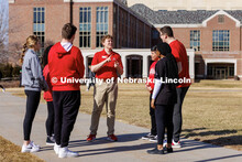 New Student Orientation Leader Jacob Vanderford leads a group across campus. NSE Leaders walking on 
