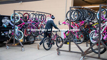Engineering student Jacob Dalton pushes a bike into Lincoln Bike Kitchen Repair. The Bike Kitchen is