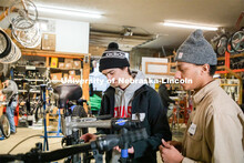 Engineering student Jacob Dalton and Connor Herbert work on repairing a bike in Lincoln Bike Kitchen