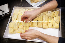 Sherri Jones, dean of college of education and human sciences, makes tamales in her home kitchen. Sh
