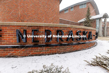The Nebraska sign in front of the Van Brundt Visitor's Center is surrounded by snow. Spring Break sn