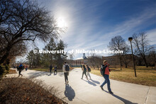 Students cross campus near the Love Library on their first day on campus following spring break. Mar