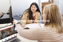Academic Advisor Bethany Heaney works with a student. Explore Center photo shoot. March 22, 2023. 