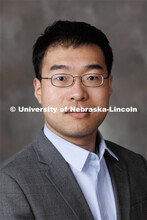 Studio portrait of Hongzhi Guo, Assistant Professor, School of Computing. March 23, 2023. 