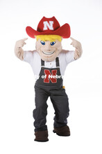 Studio portrait of Herbie pointing to the N on his hat. New Herbie photoshoot. April 7, 2023. 