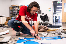Sophomore emerging media arts major Isaiah Griffith assembles props for his final project inside the