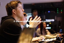 Logan Eby watches the control room monitors during the newscast. Students produce their Nebraska Nig