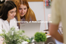 Valeria Uribe and Hannah Kate Kinney look over their project at the Jacht Ad Agency. May 10, 2023. 