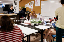 Valeria Uribe and Hannah Kate Kinney look over their project at the Jacht Ad Agency. May 10, 2023. 