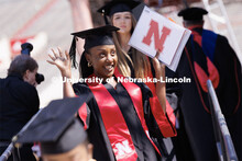 Ornella Uwayo Keza waves to family and friends after receiving her College of Agricultural Sciences 