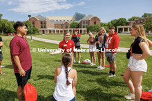 Brecken Obermueller leads her Incoming Huskers in an ice breaker where two students have to out yell