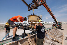 Concrete is poured into a barrier being tested at the Midwest Roadside Safety Facility for the State
