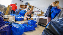 Lily Hurlock unpacks her belongings into their Smith Residence Hall room she shares with her sister,