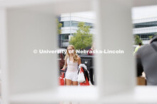 Taylor Steenson of Kansas City, Kansas, carries her belongings into University Suites. Sunday early 