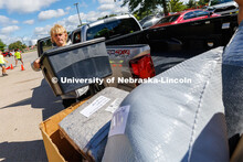 The Student Move-In Team help unload boxes from a truck. First day of residence hall move-in. August