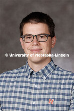 Studio portrait of Garrett Anstreicher, Assistant Professor of Economics. 2023 New Faculty Orientati