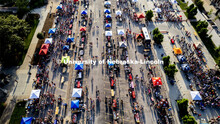 Aerial view of students and their Sunday evening shadows stroll the aisles at the Big Red Welcome St