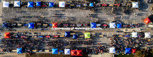 Aerial view of students and their Sunday evening shadows stroll the aisles at the Big Red Welcome St