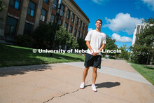 James Jura holds an “I’m a Husker &” sign. Jura is a junior biochemistry major and peer educat
