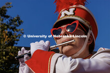 The afternoon sun reflects of Annie Von Kampen’s sunglasses as she and the piccolo section play du