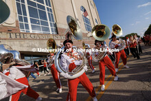 Sousaphone section of the Cornhusker Marching Band dances their way into the stadium. Northern Illin
