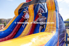 Brady McGerr races with friend Noah Rachwitz through an inflatable obstacle course at Hanging with t