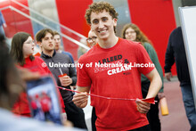 Winning pilot Luke Doughty, a software engineering student, is photographed with his creation. Engin