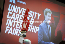 A foam finger on a robotic arm at the Rensenhouse manufacturing booth waves to Huskers. University C