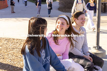 Group of friends sit and chat outside of the Union on City Campus. February 20, 2024. 