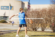 Beta Theta Pi Fraternity brothers play catch in front yard of their Fraternity house. February 20, 2