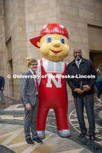 Student Body President and Student Regent, Paul Pechous (left), poses with Lil Red and Chancellor Ro