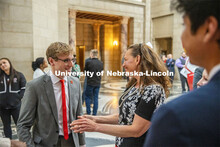 Student Body President and Student Regent, Paul Pechous (left), chats with Senator Danielle Conrad d