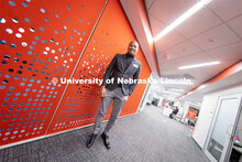 Cameron Woodard, Director of Trio Programs, poses in the Student Affairs office in Canfield Administ