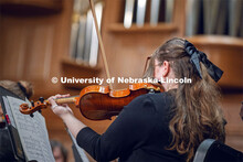 A student violinist performs during UNL Symphony Orchestra Student Soloist Night held in downtown Li