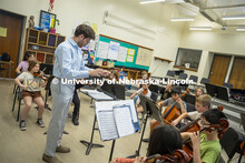 Dameer Gustafson, junior music education major, teaches the second-year string class in preparation 