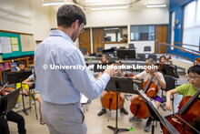Dameer Gustafson, junior music education major, teaches the second-year string class in preparation 