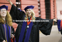 Lauren Kubat poses for the camera. College of Law commencement in Devaney on the volleyball court. M