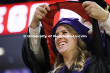 Keali French smiles as she receives her hood. College of Law commencement in Devaney on the volleyba