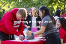 Jenni Brost, Director of New Student Enrollment watches orientation leaders outside the Union. May 2