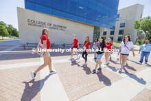Emma Georgia, Orientation Leader, leads her group on a tour of campus enroute to the rec center. New