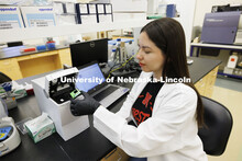 Kassandra Durazo-Martineza, a graduate student in animal science, pipettes a sample in the Flow Cyto