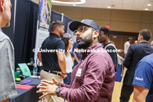 Kuljit Bhatti, a Biological Engineering graduate student talks with Chad Gross with Five Rivers Catt