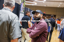 Kuljit Bhatti, a Biological Engineering graduate student talks with Chad Gross with Five Rivers Catt