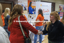 Marissa Volcek (left), a senior Agribusiness major, shakes hands with a recruiter at the East Campus