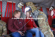 Erin Burnette, center, Director of CBA Honors Academy in the College of Business, reacts as the heli