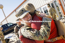 Cadet Natalie Karrels, a senior in supply chain management, hugs Erin Burnette, director of the Nebr