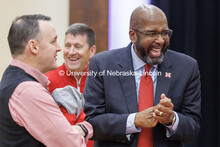 Chancellor Rodney Bennett, right, laughs as he talks to attendees of the Huddle Up Pre-Game Celebrat