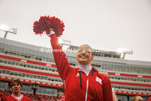 Kylie Eads, a Junior Marketing major and member of the Husker Cheer Squad rallies the crowd at the N